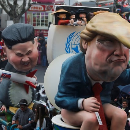 A carnival chariot is seen with figures of US President Donald Trump and North Korean leader Kim Jong-un holding a rocket during a parade in Torres Vedras, Portugal, on February 11, 2018. Photo: Reuters