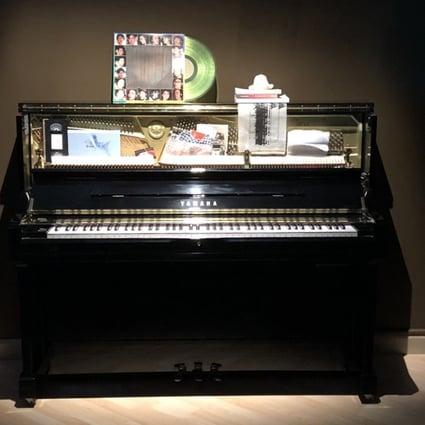 A self-playing piano with its hammers muted by a collection of different objects plays in one of the exhibition’s rooms. Photo: Enid Tsui