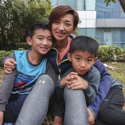 Javis Leung; his mother Lena Tsang and brother Daniel Leung. Photo: Jonathan Wong