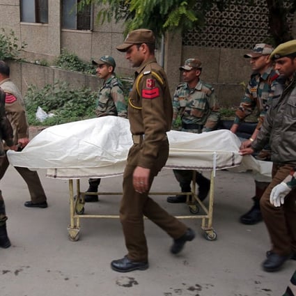 Indian army soldiers carry the body of a colleague who was killed in an attack on an army camp, on a stretcher outside a hospital in Jammu on Sunday. Photo: Reuters