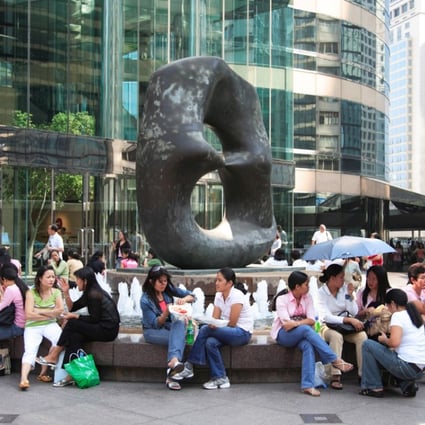 Domestic Helpers from the Philippines at Exchange Square in Central. Photo: Alamy
