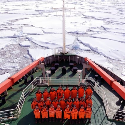 Members of China's 34th Antarctic expedition pose on the deck of China's research icebreaker Xue Long (Snow Dragon) on January 15. The ship has also been used to make voyages to the Arctic. Photo: Xinhua