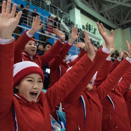 North Korean cheerleaders perform during the women's preliminary round ice hockey match between the unified Korea team and Switzerland at the Pyeongchang 2018 Winter Olympics on February 10. Photo: AFP
