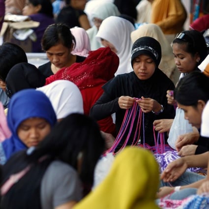 Domestic helpers gather in Hong Kong. Photo: Agence France-Presse