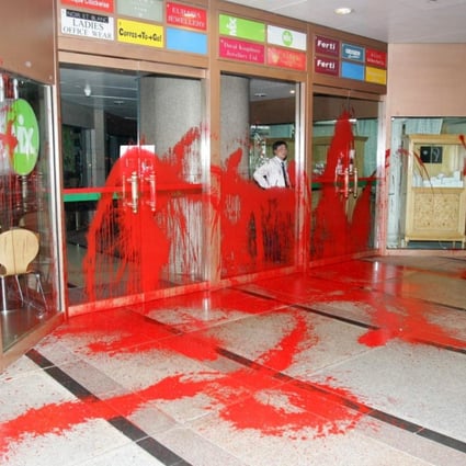 The rear entrance of the Standard Chartered Bank Building, in Central, was daubed with red paint in 2005, allegedly by debt collectors chasing payment from an employee of the bank.