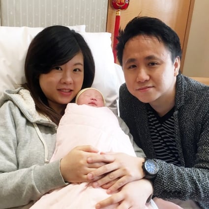 Serena Lam and Ric Fung with their newborn girl Stefanie at Hong Kong Baptist Hospital on Friday. Photo: Peace Chiu