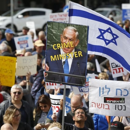 Demonstrators gathered in Tel Aviv on Friday demanding that Prime Minister Benjamin Netanyahu step down over bribery allegations put forward by the Israeli police force. Photo: EPA