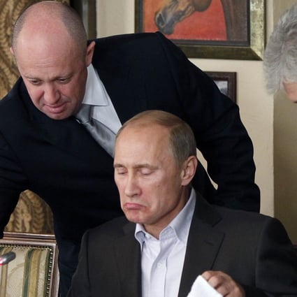 Restaurateur and businessman Yevgeny Prigozhin serves food to Russian prime minister at the time, Vladimir Putin. Photo: AP