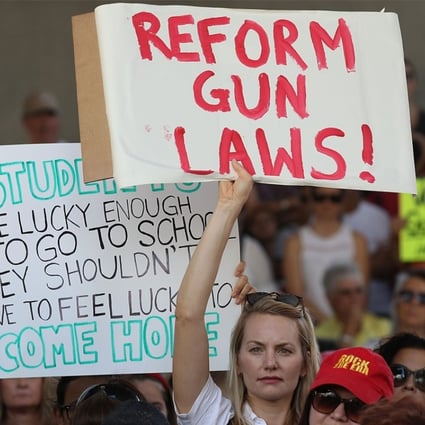 Thousands of people join together after a school shooting that killed 17 to pleading with lawmakers to change the nation’s gun laws. Photo: Getty Images/AFP