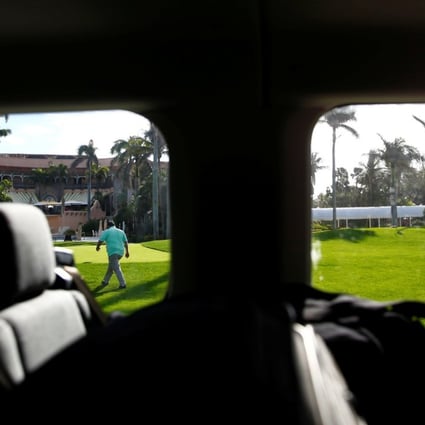 A United States Secret Service agent is seen from a press van at US President Donald Trump's Mar-a-Lago estate in Palm Beach, Florida, on Sunday. On Monday, a driver in Trump’s Mar-a-Lago motorcade was detained after he was found to be in possession of a gun. Photo: Reuters