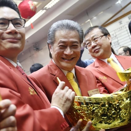 From left, Joseph Chan Ho-lim, Undersecretary for Financial Services and the Treasury and Haywood Cheung Tak-hay, president of the Chinese Gold & Silver Exchange Society, attend the exchange’s trading ceremony in Sheung Wan, on Tuesday. Photo: Nora Tam