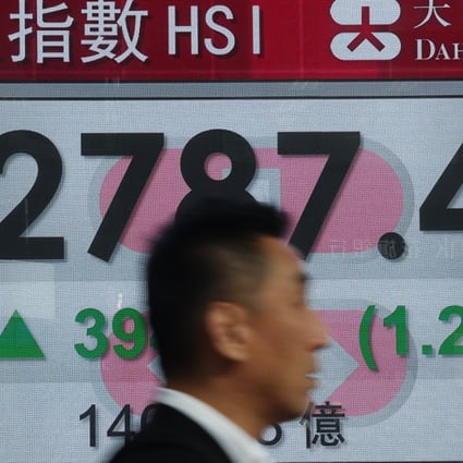 It’s January 23, 2018, and an electronic stock board shows the Hang Seng Index rising briskly. It rose a ridiculous 9 per cent rise in January. Photo: Edward Wong
