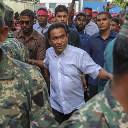 The Maldives president has called for an extension of the country’s state of emergency amid political turmoil. Pictured: President Abdulla Yameen on February 3, surrounded by bodyguards. File photo: AP 