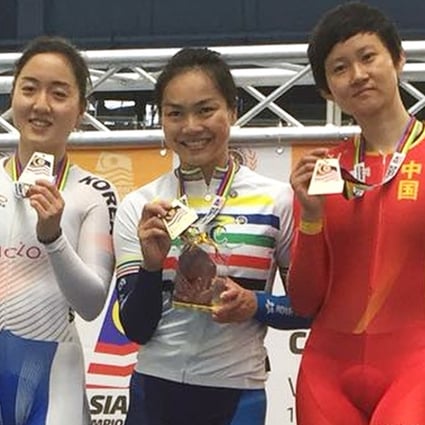 Hong Kong's Sarah Lee (centre) stands proudly on the podium after collecting her third gold in Malaysia. Photos: Handout