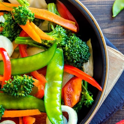 A pan full of healthy stir-fried vegetables. According to a recent Stanford University study, what seemed to help people lose weight was following a single strategy: eat less sugar, less refined flour, and as many vegetables and whole foods as possible. Photo: Alamy