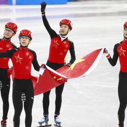 Olympic silver medallists Wu Dajing (right) Han Tianyu (second left) Chen Dequan (left) and Xu Hongzhi (second right) of China react after the short track speedskating 5,000m relay final. Photo: EPA