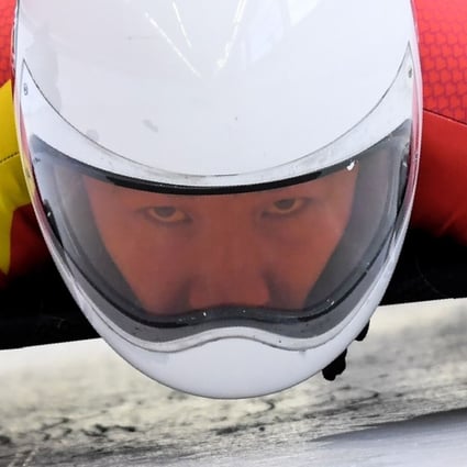 China's Geng Wenqiang takes part in a training session for the men's skeleton event at the Olympic Sliding Centre. Photo: AFP