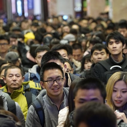 Passengers wait in queue to check in at the Beijing Railway Station in Beijing, capital of China, February 9, 2018. Photo: Xinhua