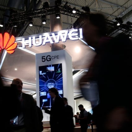People walk by the Huawei stand at the Mobile World Congress (MWC), the world's biggest mobile fair, on February 26, 2018 in Barcelona. The Mobile World Congress is held in Barcelona from February 26 to March 1. Photo: AFP