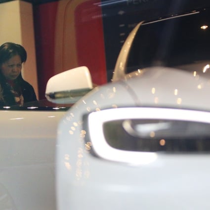Potential buyers visit a showroom for Tesla cars in Hong Kong. Photo: Dickson Lee