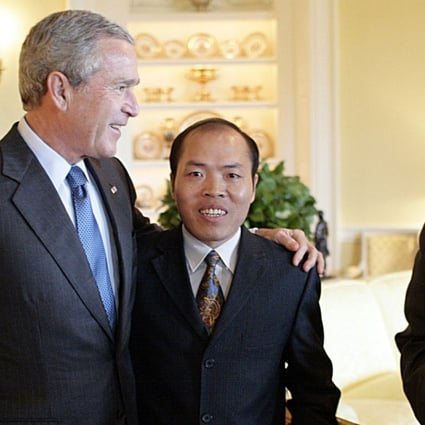 Lawyer Li Baiguang (centre) was recognised for his long-term efforts to defend the rights of farmers and Christian pastors in China. In this file photograph from 2006 he is seen meeting then US President George W Bush, who promised the activist he would raise the issue of religious freedom with China's leaders. Photo: AFP