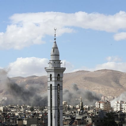 Smoke rises from the besieged Eastern Ghouta in Damascus, Syria, on Tuesday. A five-hour daily ceasefire proposed by Russia fell through when the Syrian government continued bombardment; Russia said it was due to rebels breating the truce. Photo: Reuters