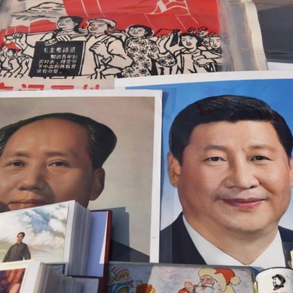 Posters of Mao and Xi Jinping at a market in Beijing. Photo: AFP