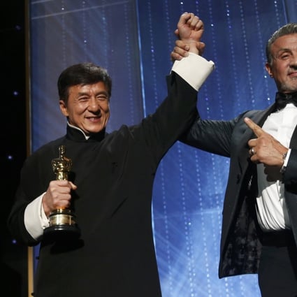 Jackie Chan (left) being congratulated by Sylvester Stallone after accepting his Honorary Award at the 8th Annual Governors Awards in Los Angeles in 2016. Photo: Reuters