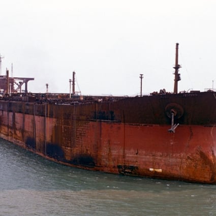 Seawise Giant, having been renamed Happy Giant, being towed into Singapore for repairs after her sinking.