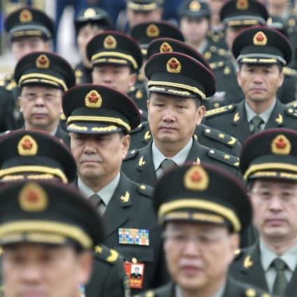 Members of the People's Liberation Army make their way to the Great Hall of the People in Beijing on Monday for the start of the National People’s Congress. Photo: Kyodo