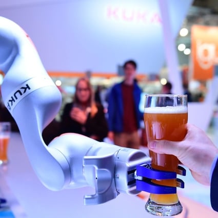 A robot made by Kuka serves beer at the Hanover Fair last April. Midea paid US$5 billion to take over Kuka in 2016. Photo: AFP