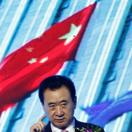 Wanda Group Chairman Wang Jianlin speaks before a deal between his company and the Abbott World Marathon Majors in Beijing. Photo: Reuters