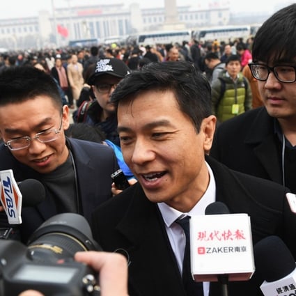 Baidu CEO Robin Li speaks to media as he arrives for the opening session of the Chinese People's Political Consultative Conference in Beijing on March 3, 2018. Photo: AFP