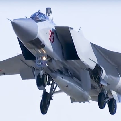 A MiG-31 fighter jet of the Russian air force carrying the new Kinzhal hypersonic missile takes off from an air base in southern Russia. The Russian military says it has run a successful test of the Kinzhal missile. Photo: AP/Russian Defense Ministry Press Service
