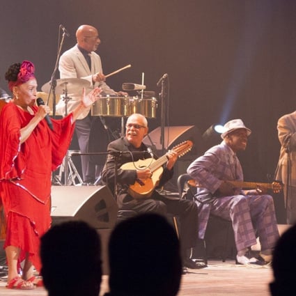 Singer Omara Portuondo (in red) in the documentary Buena Vista Social Club: Adios (category I, Spanish), directed by Lucy Walker.