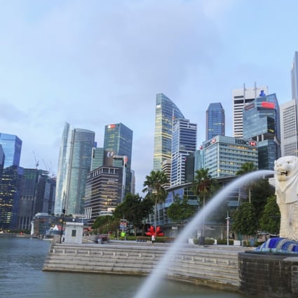 Marina Bay Sands Hotel with Merlion, the famous landmark in Singapore, in the foreground. The Lion City has active public housing and private housing markets. Photo: Shutterstock