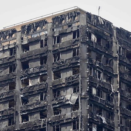 The charred remains of cladding are pictured on the outer walls of the burnt out shell of the Grenfell Tower block in north Kensington, west London on June 22, 2017. Photo: AFP