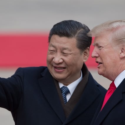 US President Donald Trump (right) talks to President Xi Jinping. The US leader upset Beijing by signing the Taiwan Travel Act. Photo: AFP