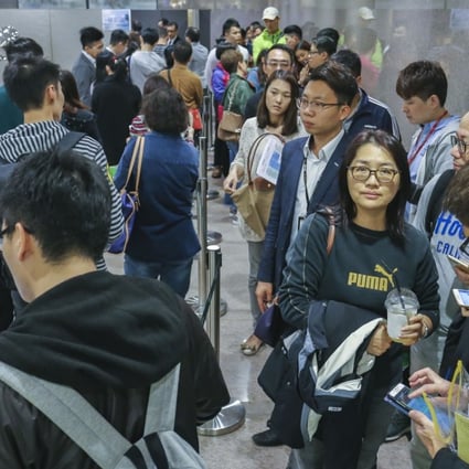 Potential buyers queuing up to bid for Wheelock’s Malibu apartments at Lohas Park in Tseung Kwan O on March 17, 2018. As many as 15 buyers registered for every unit that was available for sale. Photo: SCMP / Dickson Lee