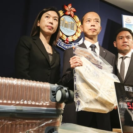 (From left) Superintendent Ng Wing-sze, Chief Superintendent Ma Ping-yiu and Chief Inspector Cheung Pak-kit from the Narcotics Bureau with 20kg of cocaine seized from a 15-year-old drug mule. Picture: Dickson Lee