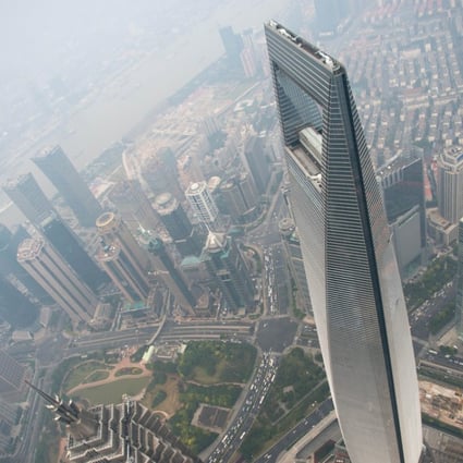 A general view shows the Shanghai World Financial Center and the skyline of the Lujiazui Financial District in Pudong, seen from the 109th floor of the Shanghai Tower. Photo: AFP