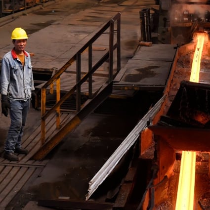 A file picture of workers at a steel plant in China's Shandong province. Photo: Agence France-Presse