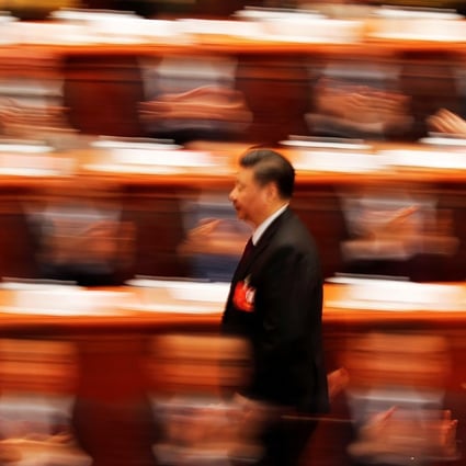 President Xi Jinping walks to deliver his speech at the closing session of the National People’s Congress at the Great Hall of the People in Beijing, on March 20. Photo: Reuters