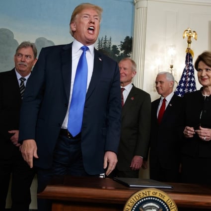 President Donald Trump speaks after he signed a presidential memorandum imposing tariffs and investment restrictions on China. Photo: AP