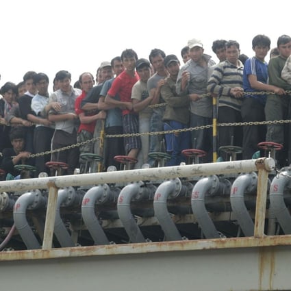 Asylum seekers are evacuated by Indonesian authorities from a tanker in Merak in Indonesia. Photo: AFP