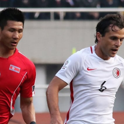 Hong Kong’s Roberto Affonso Jnr (right) outpaces his North Korea opponent. Photos: HKFA