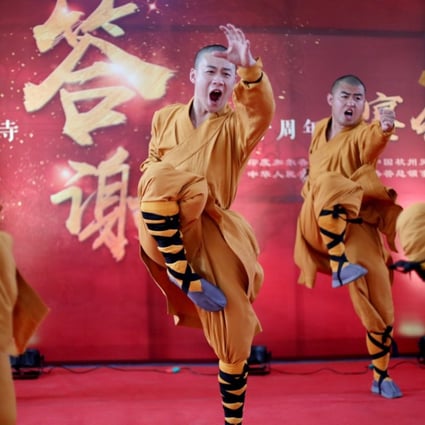Chinese monks perform martial arts during a Chinese festival at Hsuan Tsang Monastery in Kolkata, India, on March 14. The two-day festival was organised by the Chinese consulate to mark the 50th anniversary of the monastery. Photo: EPA-EFE 