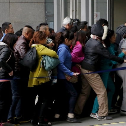 Patients rush into Peking Union Hospital in Beijing in this file photo from April 6, 2016. Elderly people in the long lines at service counters can only look on as younger Chinese used smartphones to process bookings in less than a minute. Photo: Reuters