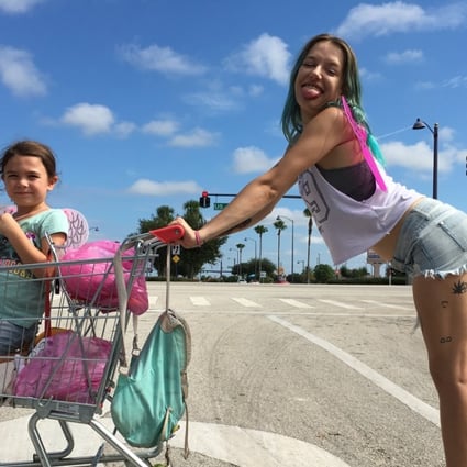 Bria Vinaite (right) and Brooklynn Prince as mother and daughter in a still from The Florida Project (category IIB), directed by Sean Baker. Willen Dafoe co-stars.