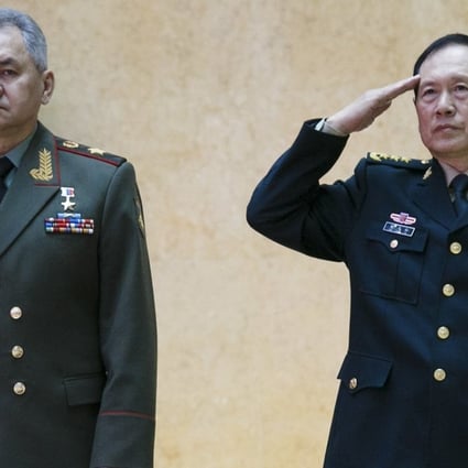 China’s Defence Minister Wei Fenghe, pictured with his Russian counterpart Sergei Shoigu, salutes during a review of an honour guard before their talks in Moscow on Tuesday. Photo: EPA-EFE